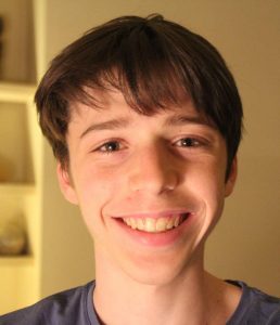 A smiling young man with dark hair. Fellow Isaiah Milbauer.