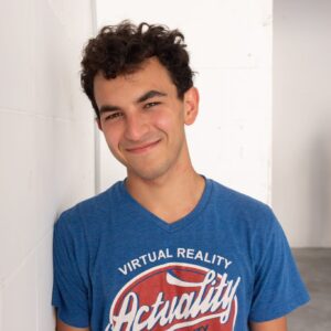 Picture of Tomer Gertel, a young man in a t-shirt.